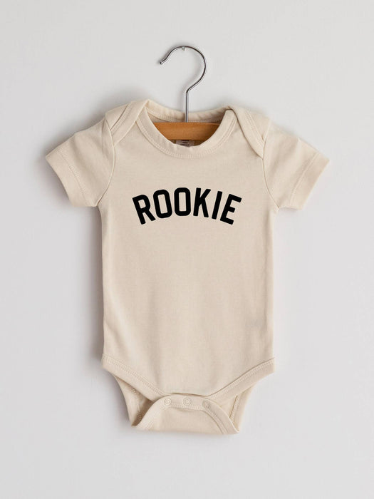 "rookie" baby bodysuit in cream