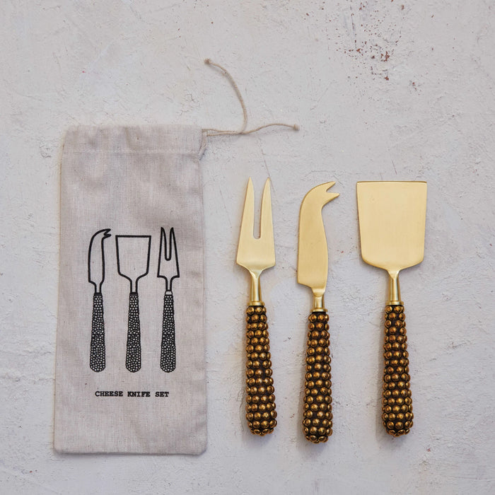 cast brass beaded cheese knife set