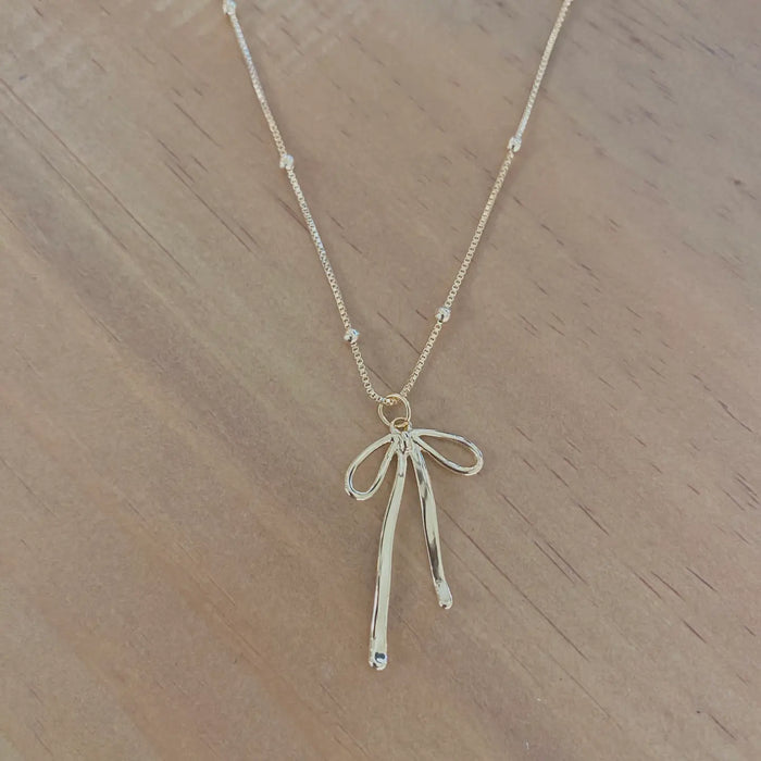 bow charm pendant necklace