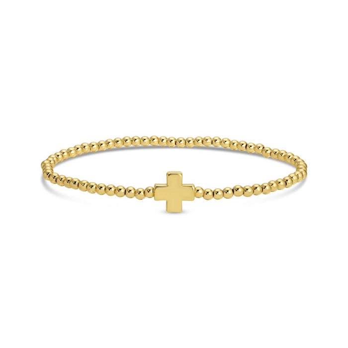 beaded stretch bracelet with single balanced gold cross