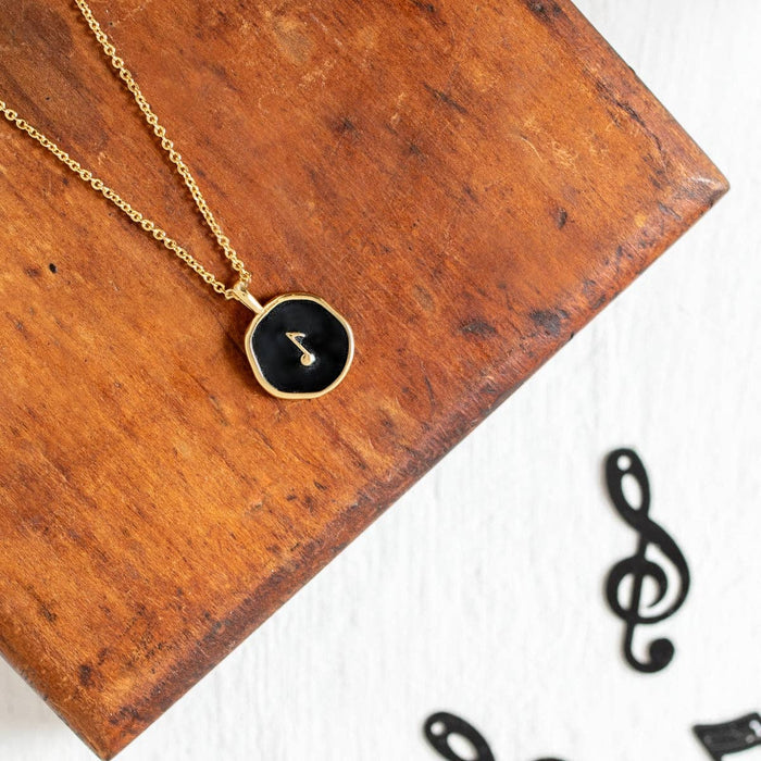 gold music note necklace